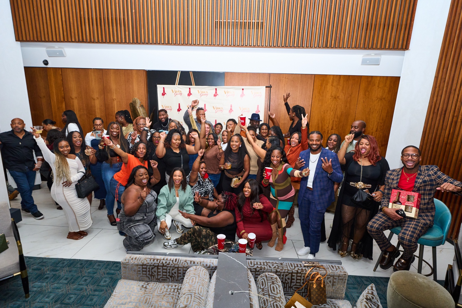 Large group of guests celebrating together at Dinner Society Vibesgiving in Dallas-Fort Worth